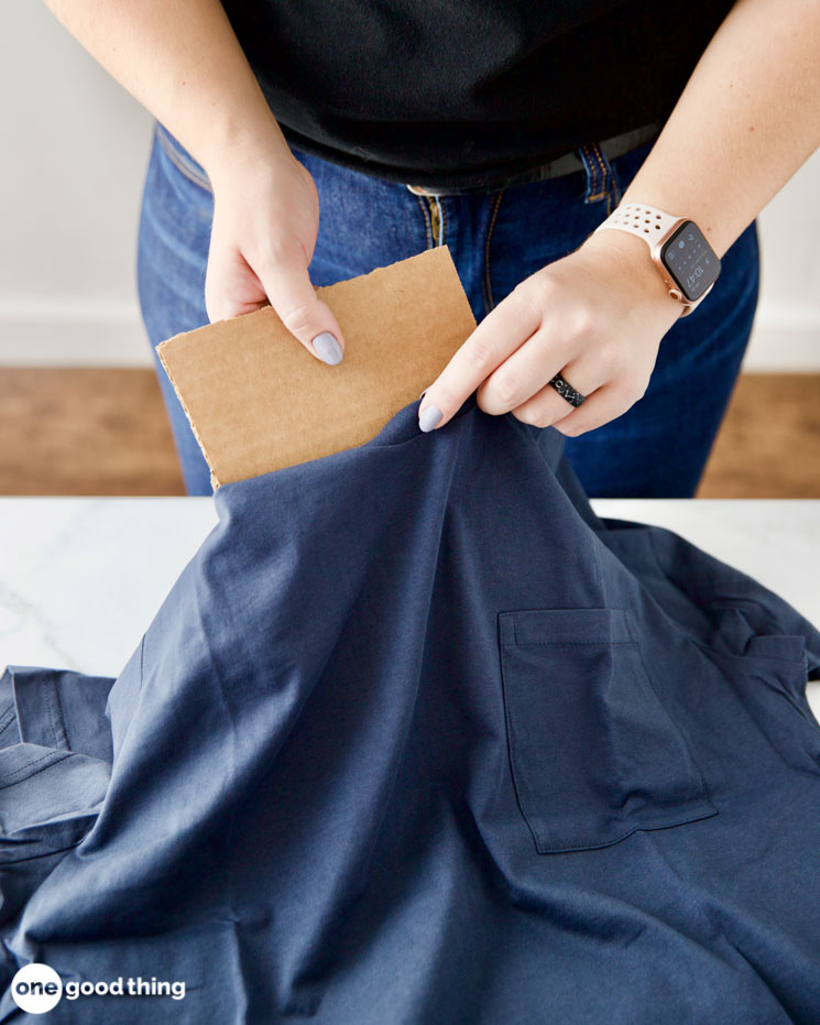 How to get oil stains out of clothing. It helps to put cardboard behind oil stains before working on them so you don't transfer the oil.