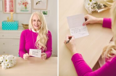 woman holding a printable thank you card and writing on the inside