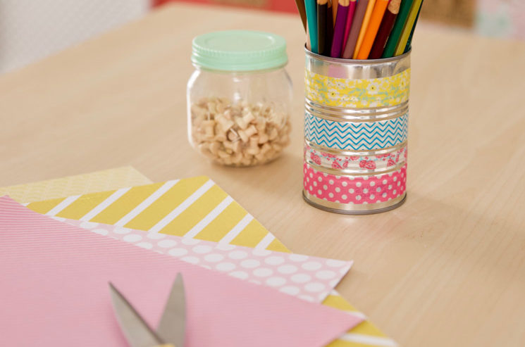 repurposed tin can holding colored pencils and covered in washi tape